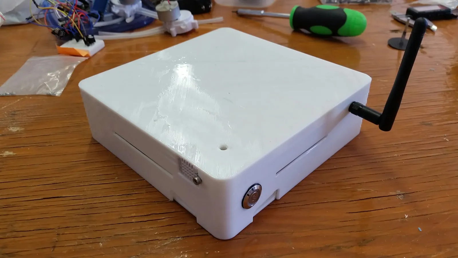 White 3D printed electronics enclosure with external WiFi antenna and power button